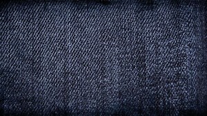Download Stylish dark blue denim texture stop-motion background loop with scratches, worn details, and fashionable close-ups, perfect for a trendy and grunge inspired fashion or design project. for free