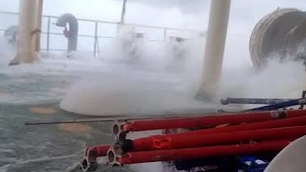 Rough waves flood ship deck during North Atlantic storms