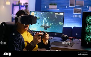 Winner gamer wearing virtual reality goggles, playing space shooter video games in room with RGB. Pro video game r using professional joystick during digital championship at gaming home studio Stock Photo - Alamy