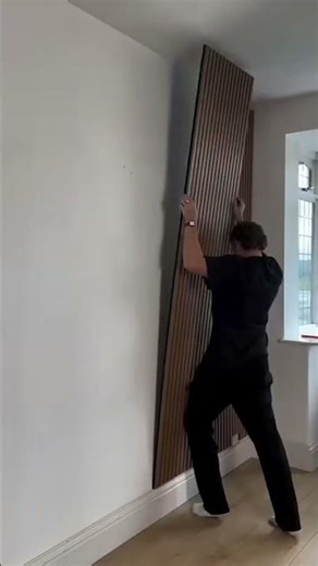 Installation of panel board on living room wall for elegant interior #shorts