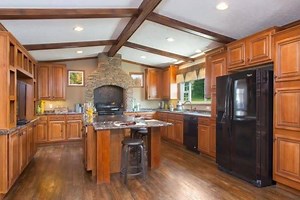 The Perry model is a 1920 sq. ft. 3 bedroom, 2 bath model that features a statement-making stone stove surround plus a media center in this spacious kitchen! Great materials, surfaces and textures make this home a must-see! TELL US: What's your favorite part of this home? Click here for pricing, availability and more info: http://bit.ly/2vPEGmq | Clayton