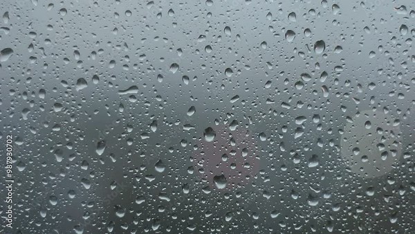 Heavy raindrops tapping on the window pane. Raindrops flowing down the window pane during a downpour. Rainy weather Stock Video
