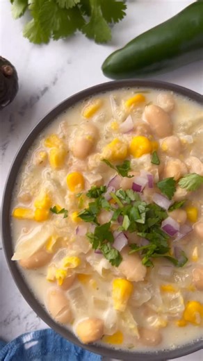 This white bean chili is perfectly spicy and creamy for a vegetarian meal that is ridiculously easy to make. The secret? Adding salsa verde to the broth and blending some of the soup into the broth to make it extra hearty. Give it a try! . Ingredients 1 tablespoon olive oil 1 yellow onion, diced 3 cloves minced garlic 1 cup salsa verde 2 cups vegetable broth 1 (15oz) can cannellini beans, drained and rinsed 1 (15oz) can chickpeas, drained and rinsed 1 (15oz) can sweet corn, drained 2oz cream che