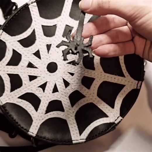 I (finally) finished this spider web bag~ 👻 All done by hand, many many hours designing, cutting, and stitching. It features a little spider hanging from the zipper puller, it will dangle with you as you walk! Was doing it in between other jobs so it took a while. Sorry for those who had been waiting! This particular spooky bag is a mini backpack. (But future editions might be a shoulder bag, depending on which people like most!) #spiderwebbag #spiderdesign #spiderweb #goth #gothfashion #gothac