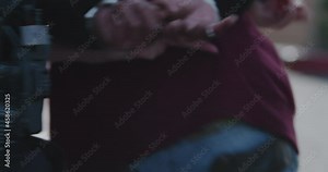 Man Is Put In Hand Cuffs, Arrest By Two Police Officers, Cops, Under Arrest. Hands Behind Back, Rough