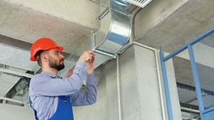 Hvac worker install ducted pipe system for ventilation and air conditioning
