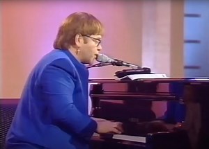 Watch Elton John create a song on the spot using words from an oven user manual