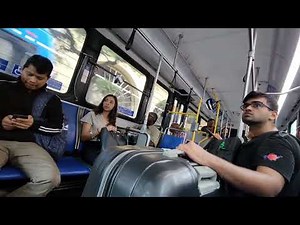 College Cutie stares at Big Bulge on the bus