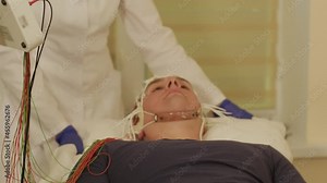 Patient brain testing using encephalography at medical center