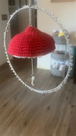 Working on a crocheted mushroom sun catcher.