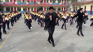 Chinese school principal dances in-sync with students during break time