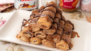 820K views · 8.1K reactions | Tostadas Francesas de Crema Lotus y Nutella 李 Ingredientes: 10 rebanadas de pan de molde Crema de galletas Lotus Crema de cacao con avellanas (nutella, nocilla, etc..) 100 ml de leche 1 huevo 20 gr de azúcar 1/2 cucharadita de esencia de vainilla 40 gramos de mantequilla sin sal Azúcar y un poco de canela para decorar #tostadas #lotus #nutella | Platos Fáciles con Tamara | Facebook