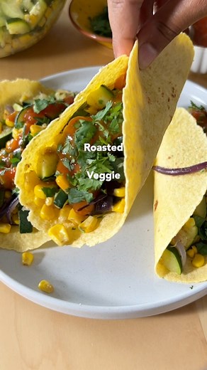 Recipe is below! 👇🏽 🌮 These roasted veggie tacos are easy to prepare, require just a few simple ingredients and a handful of pantry-staple spices, and are ready in under 30 minutes. Best of all, these meatless roasted vegetable tacos are so tasty no one will miss the meat – and they can be prepared gluten-free, too! | Plant-Based on a Budget