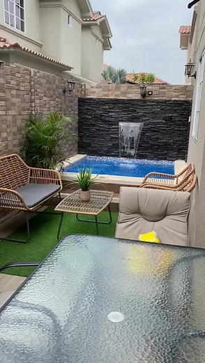 Tranquil Backyard Pool with Waterfall Features