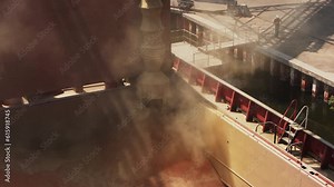 Grain loading to bulker ship cargo container at sea grain terminal in seaport. Wheat shipment from silos to bulk vessel via trunk at sea port. Transportation of agricultural harvest commodities. Stock Video