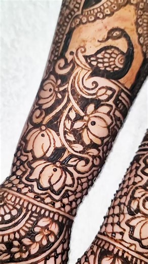 Jill's Henna Creation 🇬🇾 Leah's Bridal Henna On the bride’s hands, the lotus flowers bloom with quiet elegance while the peacocks rest in their royal grace — every line and curve coming together to tell a sweet story of love, beauty, and the blessings that surround her as she steps into a new chapter. #viral #foryoupage #fyp #henna #mehndi