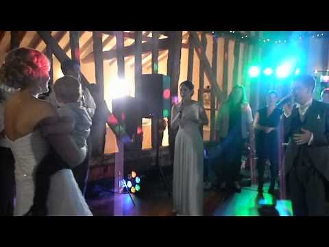 Groom surprises Bride with live rendition of Thinking Out Loud feat their wedding guests!