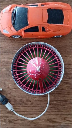 Testing a homemade mini fan found in a pile of old toys.