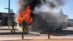Firefighters rush to salvage a Transperth bus engulfed in flames