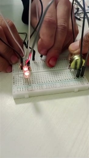 students playing with potentiometer circuit