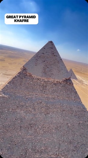 Drone footage over the pyramid of Khafre. This is the pyramid which has been in the news lately about underground radar and the possibility of something underneath. The Second Great Pyramid of Giza, built for Pharaoh Khafre around 2570 BC, might not be the tallest—but it certainly looks like it is. That’s because it was constructed on higher ground and has a slightly steeper angle than his father Khufu’s pyramid. For centuries, it’s tricked the eye. Khafre’s pyramid stands at about 136 meters to