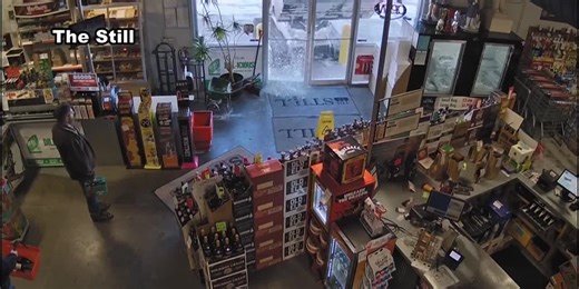 WATCH: Man drives skid loader into entrance of Lincoln business