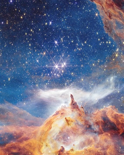 This isn’t a winter landscape. It’s Pismis 24 — a young, blazing star cluster about 5,500 light-years away in the Lobster Nebula. Infrared light from the James Webb Space Telescope reveals dense clouds where stars are forming. X-ray data from Chandra X-ray Observatory adds bursts of color — high-energy signatures from some of the hottest, most massive young stars in our galactic neighborhood. This region is one of the closest laboratories for studying how massive stars are born, evolve, and shap