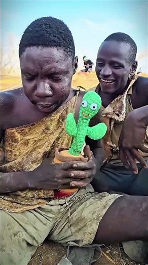 Chaba is having fun with the doll.#hadzatribe #africa #usa #africanculture #brasil #channel #viral