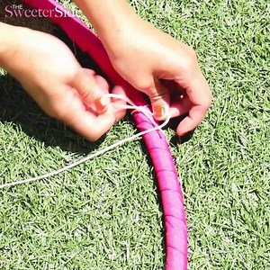 Materials: Hula hoop Thick ribbon Super glue String Chinese lanterns String lights Scissors Instructions: 1. Wrap ribbon around the hula hoop. Secure with glue. 2. Assemble the lanterns 3. Tie the rope on the wire of the lanterns. Set aside 4. Cut 4 long strings and make a loop at one end. 5. Place the loop in the middle of the hoop and tie and other ends evenly around the hoop 6. Hang the hula hoop and add the lanterns one by one making sure weight is distributed evenly. 7. Wrap the string ligh