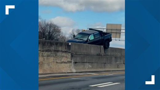 WATCH: Pickup truck seen hanging over median after crash on I-75/85 south in Atlanta