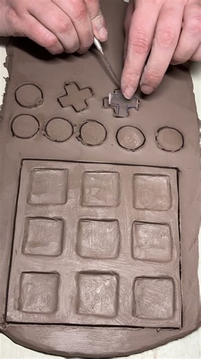 Carving a tic-tac-toe board using a template #pottery #shorts