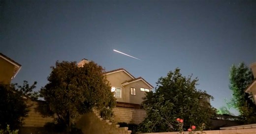 SpaceX Dragon cargo spacecraft streaks across the sky