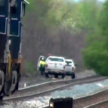 Tree Falls on Tracks In Front Of Fast Moving Train