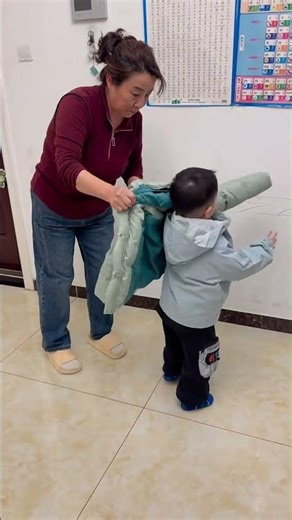 He just wants to walk. She makes sure he’s warm while doing it. ✅