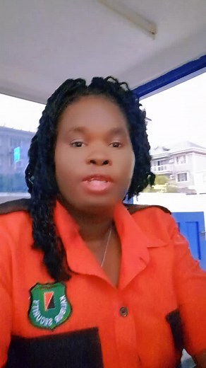 Nurse Explains Health Tips in Orange Shirt