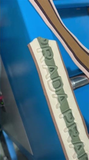 Automatic elastic band logo embossing machine for pattern making