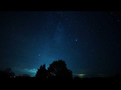 Timelapse of multiple sunsets, the moon and the stars' movement.