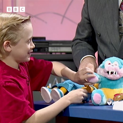 What do kids want this Christmas? Back in 1991, Macaulay and Kieran Culkin got to try out some Moon Shoes, WereBears, talking Bart Simpson dolls and remote-control cars with Terry Wogan. | BBC Archive