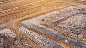 The disposal of landfill waste can have a negative impact on the environment. landfills can leach pollutants into the surrounding soil and water, leading to contamination of the local ecosystem. Stock Video