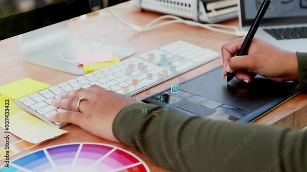 Using digital pen tablet, person editing graphics over color palette animation