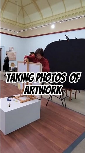 Taking photos of artwork at the exhibition for Social Media and Online Catalogs.