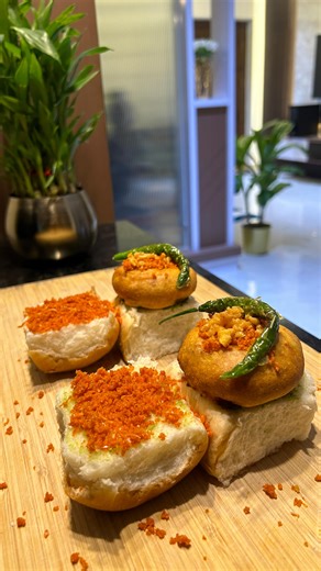 Shiv on Instagram: "The weather was screaming for Vada Pav🌧️🌶️ Method: Step 1 – Make the Batter: In a bowl, add 2cups of besan, salt, ajwain, and a pinch of baking soda. Whisk everything together while slowly adding water until you get a smooth, lump-free batter. Let it rest for 30 minutes. Step 2 – Prepare the Chilli-Garlic Paste: In a mortar, add 2–3 green chillies, 3–4 garlic cloves, a small piece of ginger, and a pinch of salt. Grind using a pestle into a coarse paste and kee