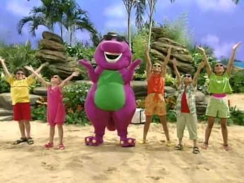 Barney and kids put hands in the air