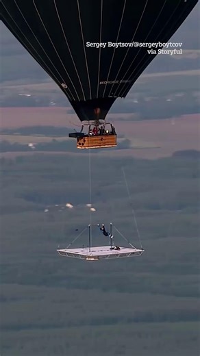 219K views · 164 reactions | Daredevil Athlete Performs Gymnastics Under Hot-Air Balloon | The Sun | Facebook