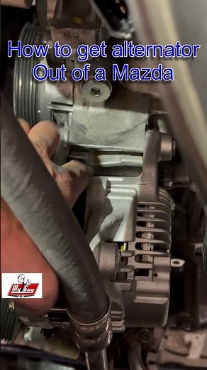 Having trouble with a Mazda alternator? Olsen the mounting bolt and pull the alt forward and out