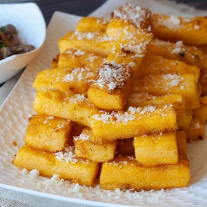 Italian Crispy Fried Polenta Cakes With Taleggio And Truffle Sauce