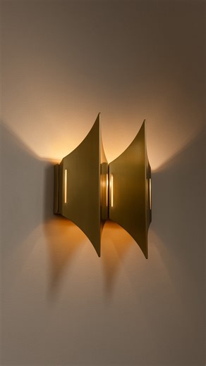 LYFA on Instagram: "GOTHIC II. A sculptural wall lamp with a strong architectural presence, designed by Bent Karlby in 1970. The dual shade fixture emits soft bi-directional lighting that leaves a beautiful pattern on the wall, while the brushed surfaces are subtly illuminated through the narrow peepholes. Find the collection at LYFA.com"