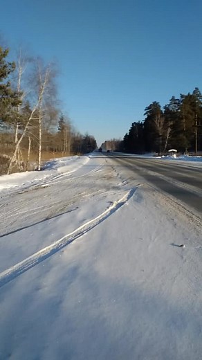Snowplow Truck Clearing Rural Roads in Winter