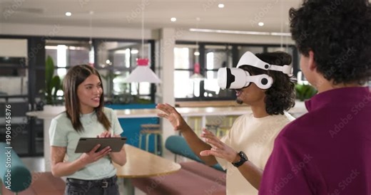 African American team in office woman tapping tablet guiding VR user testing demo, copy space