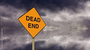 101GI20Coming to a dead end. Stop, final, finished no opportunity or hope. A dead end road sign with timelapse clouds in the background.